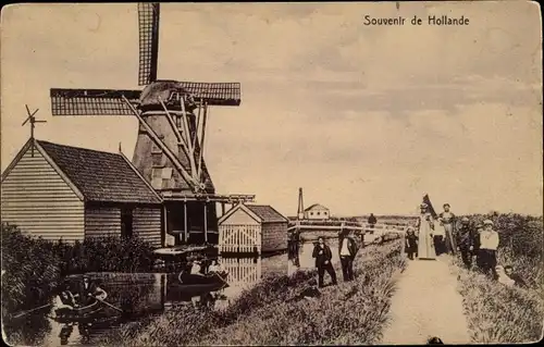 Ak Niederlande, Partie im Dorf, Windmühle, Molen
