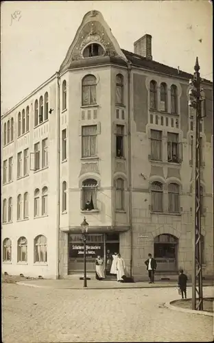 Foto Ak Bad Segeberg? Neumünster ?, Straßenpartie mit Bäckerei