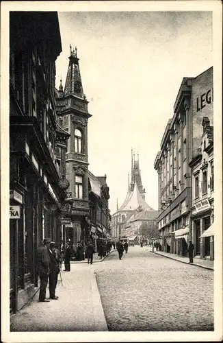 Ak Louny Laun Region Aussig, Straßenpartie, Passanten, Geschäfte