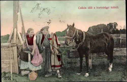 Ak Ungarn, Mann und Frau in Volkstrachten am Brunnen, Pferd