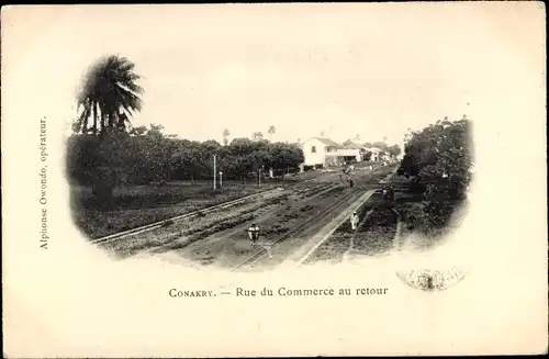 Ak Conakry Guinea, Rue du Commerce zurück