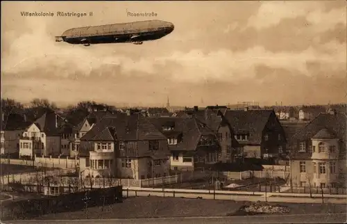 Ak Rüstringen Wilhelmshaven in Niedersachsen, Zeppelin über der Rosenstraße