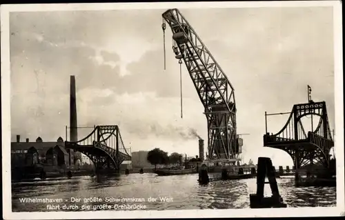 Ak Wilhelmshaven in Niedersachsen, Der größte Schwimmkran der Welt fährt durch die größte Drehbrücke