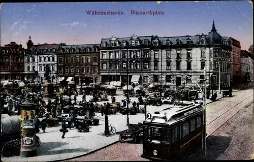 Ak Wilhelmshaven an der Nordsee, Bismarckplatz, Straßenbahn, Litfaßsäule, Denkmal