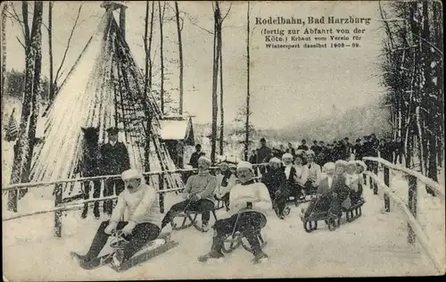 Ak Bad Harzburg am Harz, Rodelbahn, Menschen mit Schlitten, Winter