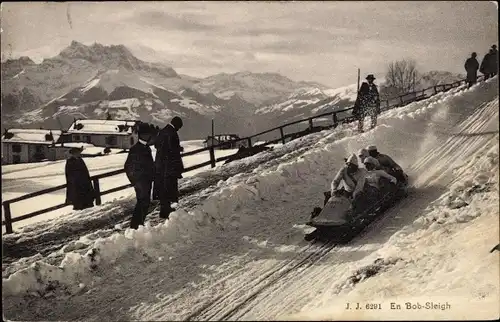 Ak Wintersport, Männer fahren Bob, Bobfahrt, Winterszene