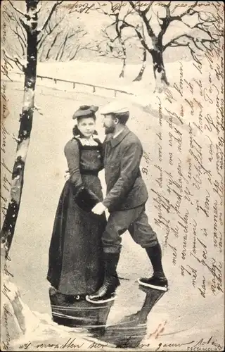 Ak Liebespaar beim Eislaufen, Zugefrorener See