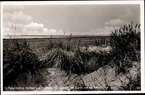 Ak Nordseebad Sankt Peter Ording, Blick durch die Dünen auf die Badebrücke