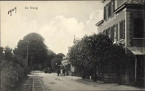 Ak De Steeg Rheden Gelderland, Straßenpartie, Bahnschienen