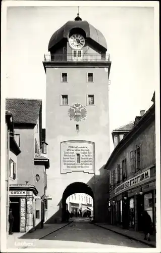 Ak Leoben Steiermark, Straßenpartie, Tor, Golles, Warenhaus, Stadtturm