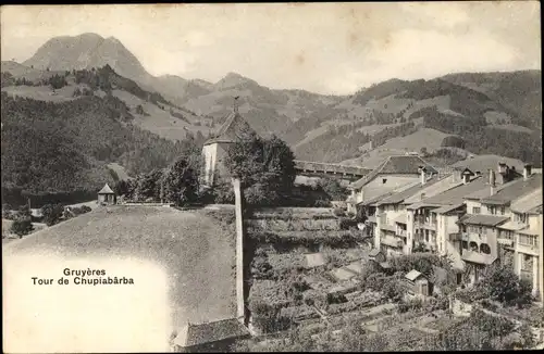 Ak Gruyères Kt. Freiburg Schweiz, Tour de Chupiabarba, Turm, Wohnhäuser mit Gärten
