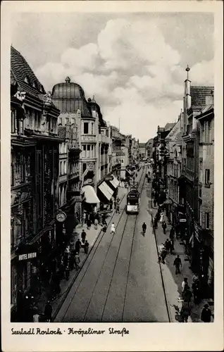 Ak Hansestadt Rostock, Kröpeliner Straße, Straßenbahn, Geschäftshäuser