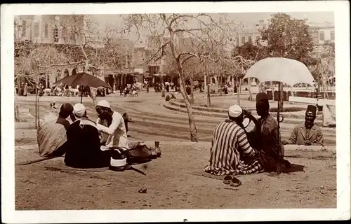 Ak Cairo Kairo Ägypten, Stadtansicht, Einheimische, Sonnenschirm, Platz