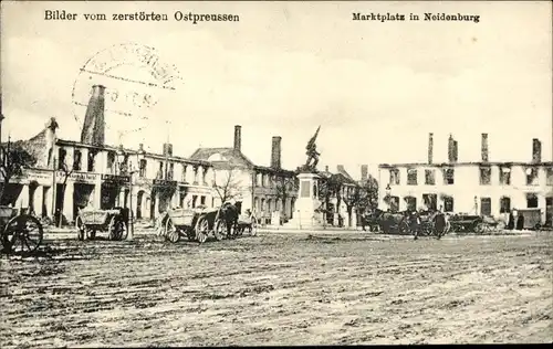Ak Nidzica Neidenburg Ostpreußen, Marktplatz, zerstörte Häuser