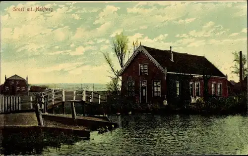 Ak Halfweg Haarlemmermeer Nordholland, Haus am Wasser mit Brücke