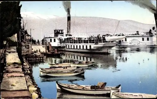 Ak Gardone Riviera Lombardia, Dampferankunft, Gardasee, Ruderboote