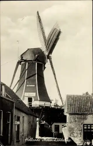 Foto Ak Niederlande, Windmühle, Ortschaft