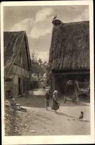 Ak Rackel Malschwitz, Deutsche Heimatbilder, Frühlingssonne im Ort, Reetdachhäuser, Kinder