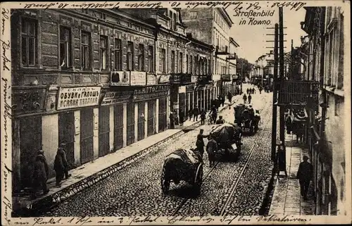 Ak Kaunas Kowno Kauen Litauen, Straßenpartie, Wagenkolonne, Geschäfte, Schuhgeschäft, I. WK