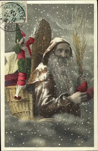 Ak Glückwunsch Weihnachten, Weihnachtsmann im Schneefall, Puppe, Rute