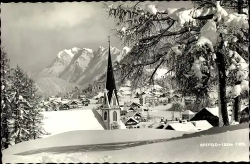 Ak Seefeld in Tirol, Teilansicht vom Ort, Kirche, Winter