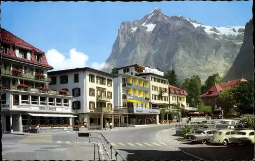 Ak Grindelwald Kanton Bern, Straßenpartie mit Wetterhorn, Hotels, Geschäfte