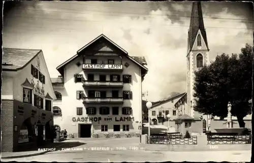 Ak Seefeld in Tirol, Teilansicht mit Gasthof zum Lamm, Kirche