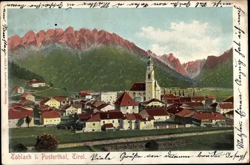 Ak Toblach Dobbiaco Südtirol, Totalansicht, Kirche, Gebirge