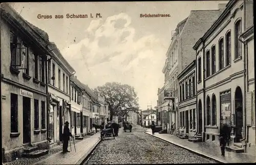 Ak Schwaan in Mecklenburg, Brückenstraße, Geschäfte