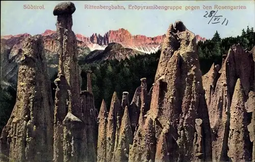 Ak Rittenbergbahn Südtirol, Erdpyramidengruppe gegen den Rosengarten
