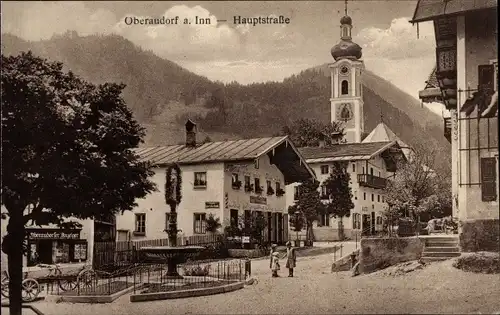 Ak Oberaudorf am Inn Oberbayern, Hauptstraße, Brunnen, Glockenturm, Gasthof