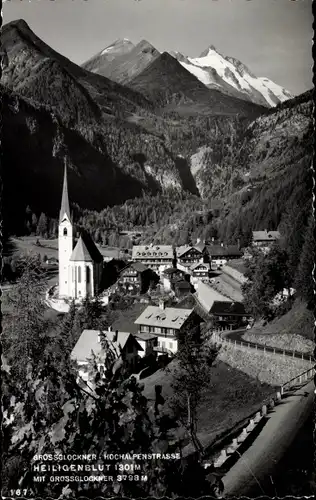 Ak Heiligenblut am Großglockner in Kärnten, Totalansicht der Ortschaft, Kirche, Gebirge