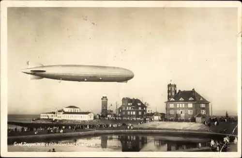 Ak Cuxhaven in Niedersachsen, Luftschiff LZ 127 Graf Zeppelin über der Stadt