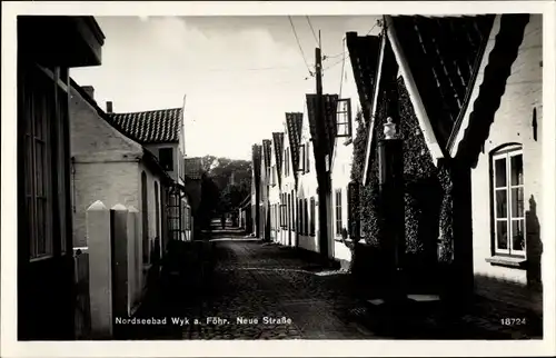 Ak Nordseebad Wyk auf Föhr, Blick in die Neue Straße, Wohnhäuser