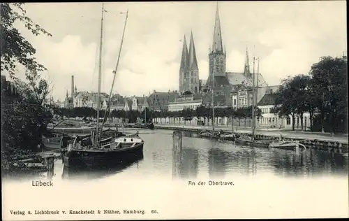 Ak Lübeck, an der Obertrave, Kirche, Boote, Promenade