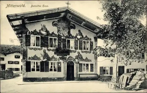 Ak Mittenwald in Oberbayern, bemaltes Haus, Bank