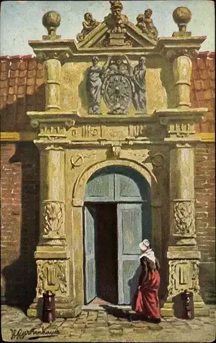 Künstler Ak Gerstenhauer, Johann Georg, Frau in niederländischer Volkstracht vor einem Gebäudeportal