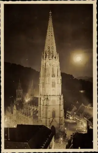 Ak Freiburg im Breisgau, Münster, Nachtbeleuchtung