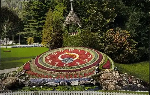 Ak Interlaken Kanton Bern Schweiz, Blumenuhr im Kurgarten