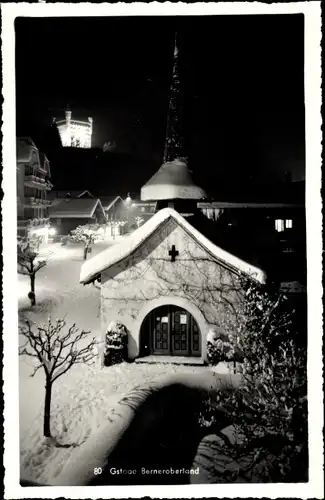 Ak Gstaad Kanton Bern, Kirche bei Nacht