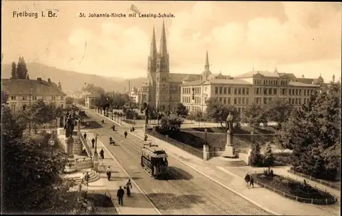 Ak Freiburg im Breisgau, St. Johannis-Kirche, Lessing-Schule, Tram