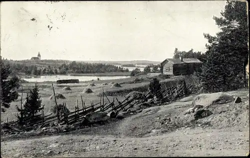 Ak Ruona Finnland, Ortsansicht, See, Holzhütte