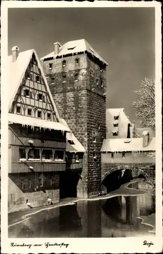 Ak Nürnberg in Mittelfranken, Ortspartie, Brücke, Turm, Winter