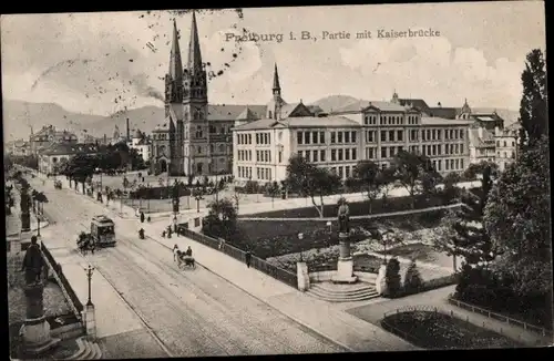 Ak Freiburg im Breisgau, Teilansicht, Kaiserbrücke, Straßenbahn, Denkmal