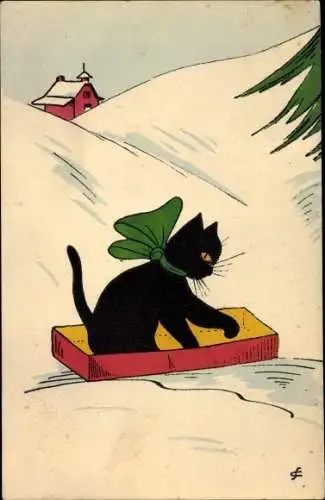 Künstler Ak Schwarze Katze mit grüner Schleife in einer Kiste, Schneelandschaft