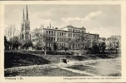 Ak Freiburg im Breisgau, Lessingschule als Lazarett, Dreisam, Johanneskirche