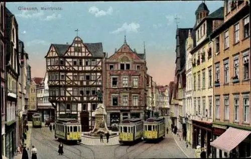 Ak Gießen an der Lahn Hessen, Marktplatz, Fachwerkhaus, Straßenbahnen, Denkmal