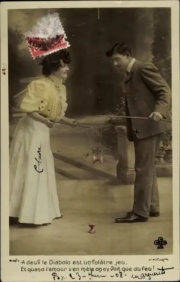 Ak Mann und Frau spielen mit Diabolos, Liebespaar
