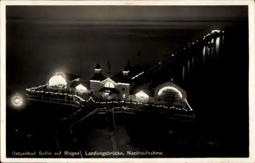 Ak Ostseebad Sellin auf Rügen, Landungsbrücke, Nachtbeleuchtung