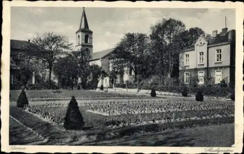 Ak Unna Westfalen, Partie im Stadtgarten mit Blick auf die Kirche